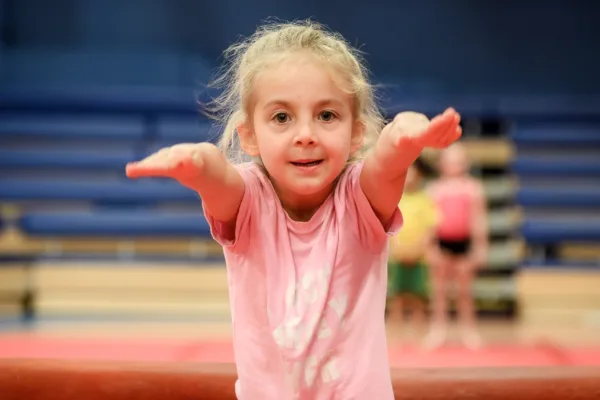 Girl participating in gymnastics class