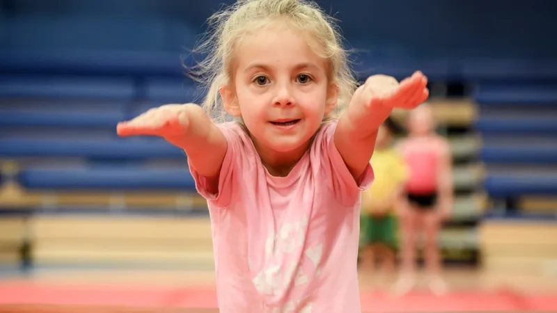 Girl participating in gymnastics class