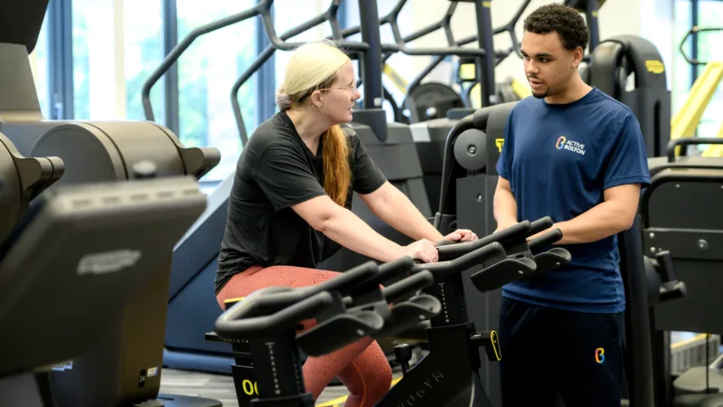 Person using exercise bike