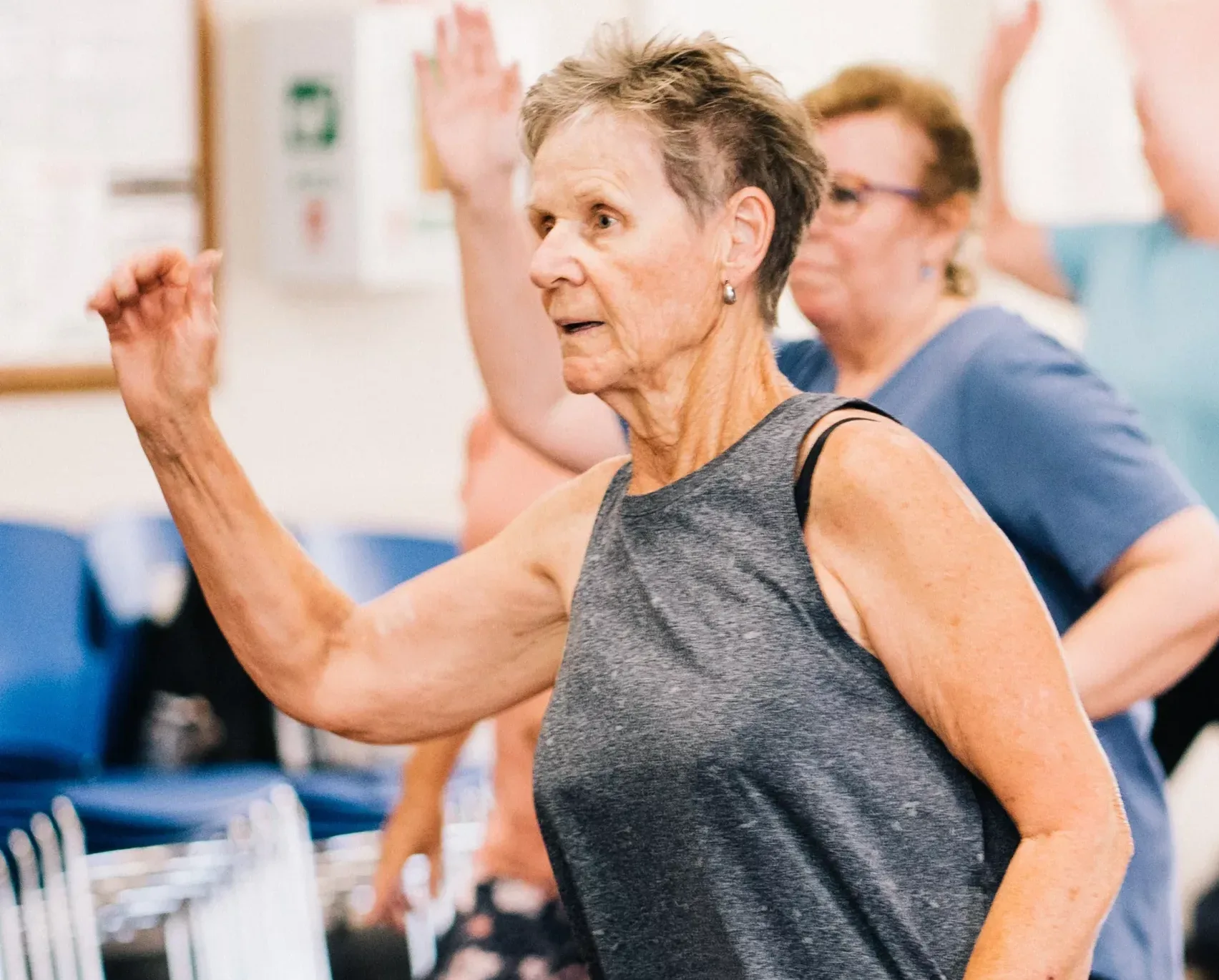 older woman doing an exercise class