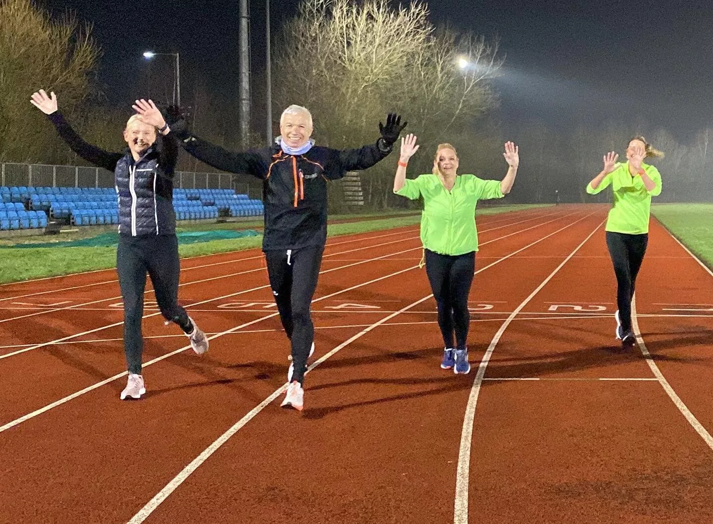 runners on the track at Bolton Arena