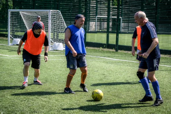 Men playing walking football at Active Bolton Arena