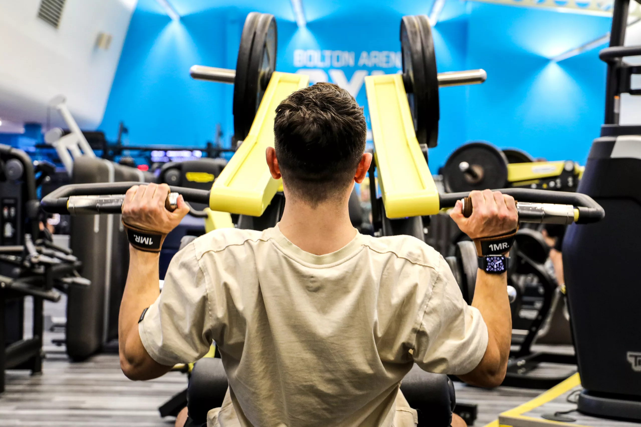 Bolton Arena gym, man on weight machine