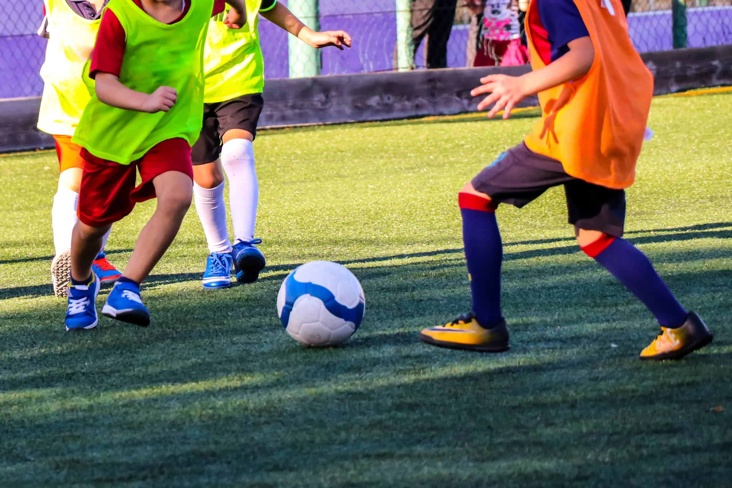 Childrens play on the football field at Bolton Arena