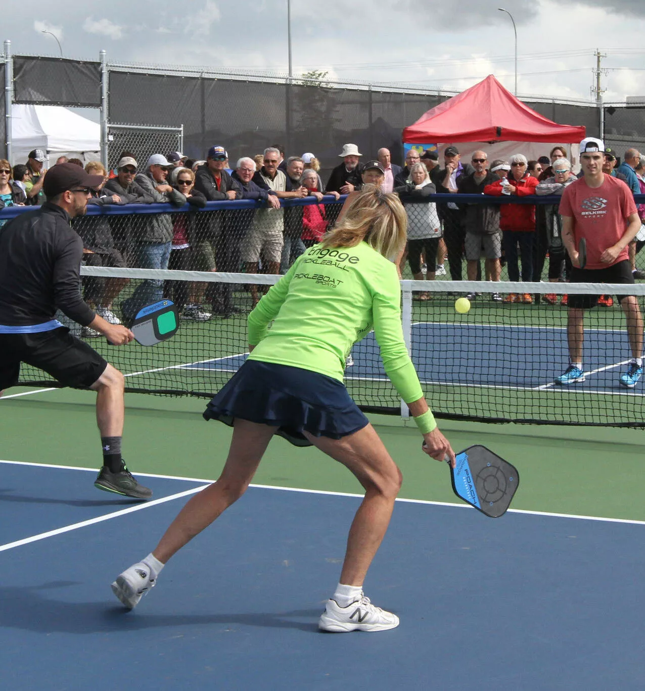Couples playing Pickleball outdoors in nationals