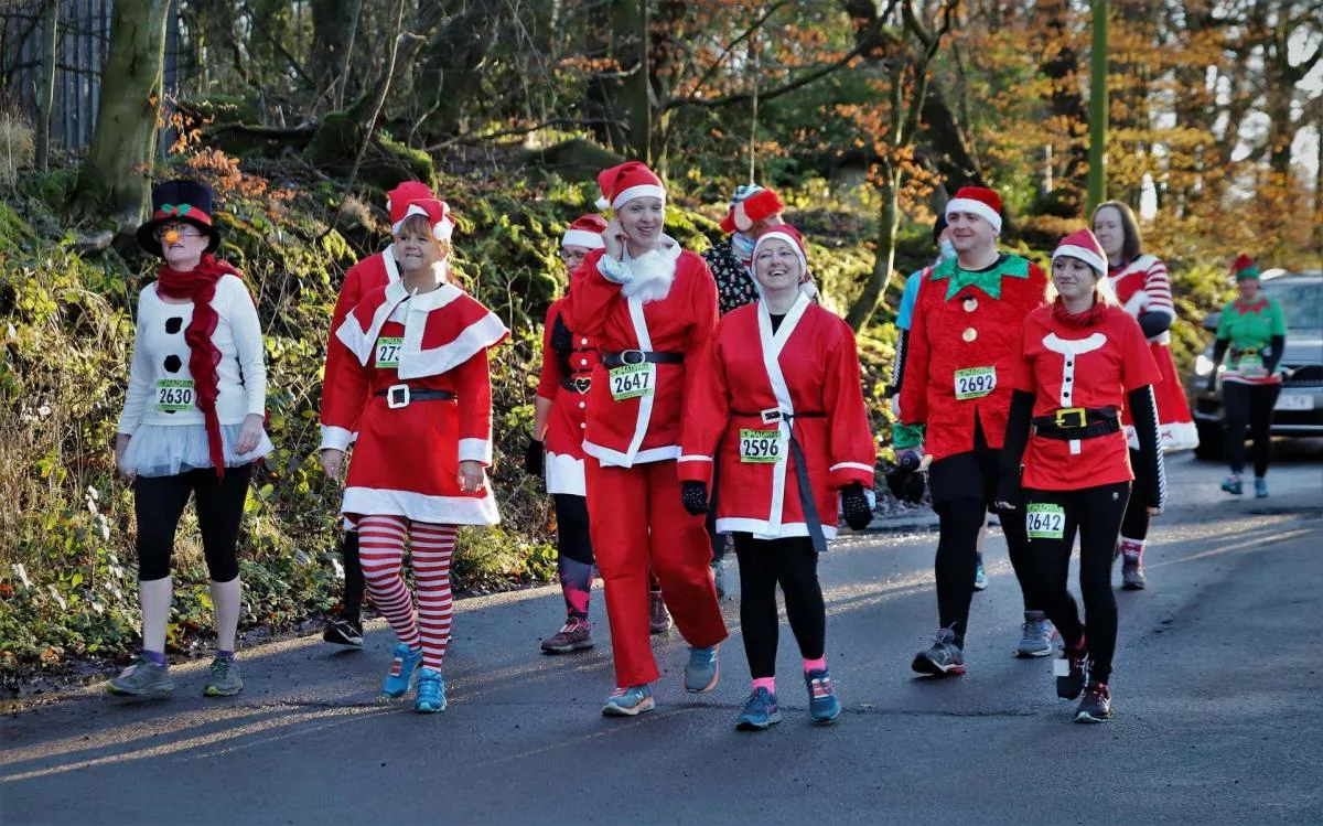 Bolon Arena Santa Dash 2021, group of runners in santa costumes get into the fundraising spirit