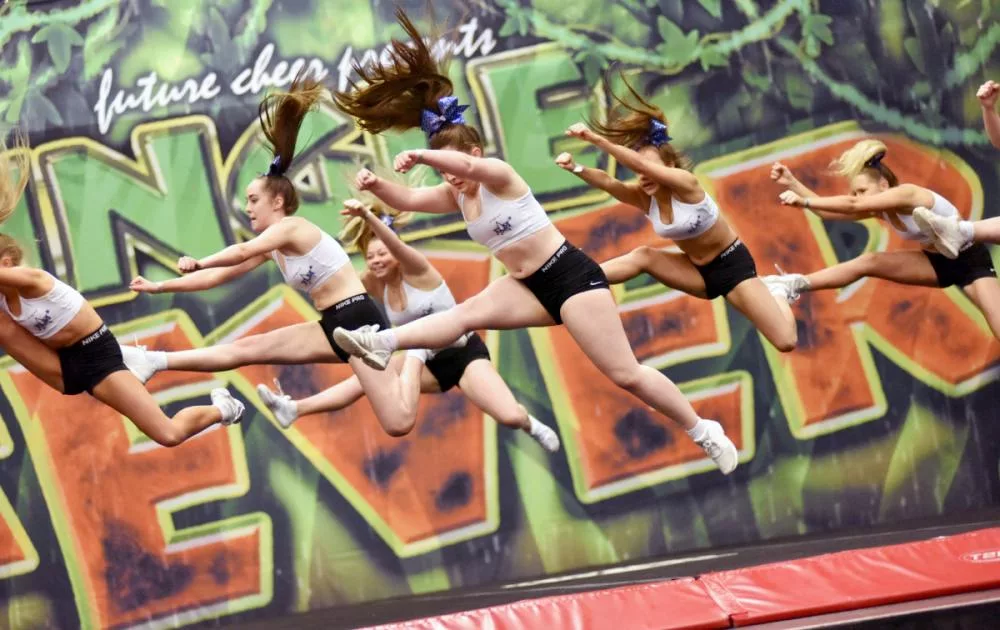 Jungle Fever comp 2022 action shot of cheerleaders leaping