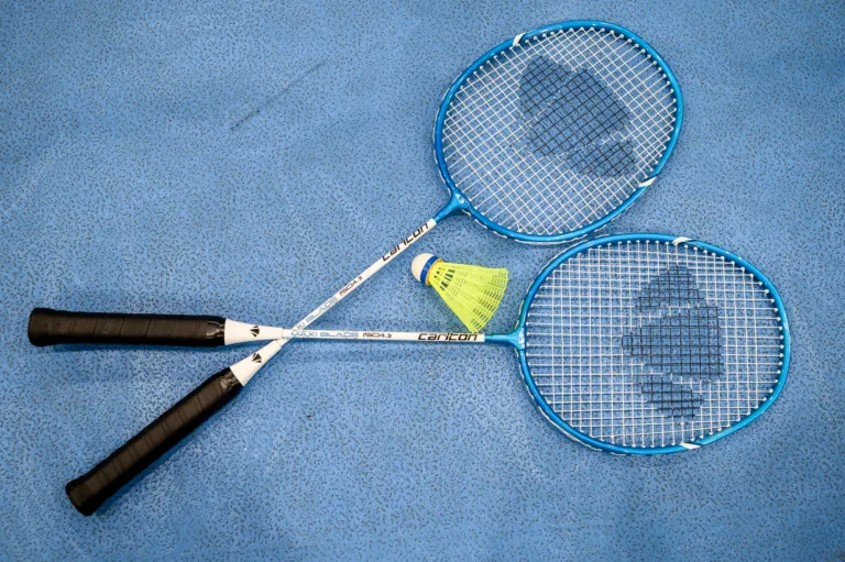 Badminton racquets on sports hall floor