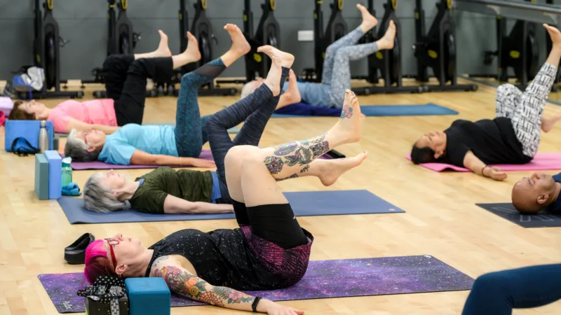People participating in group fitness class