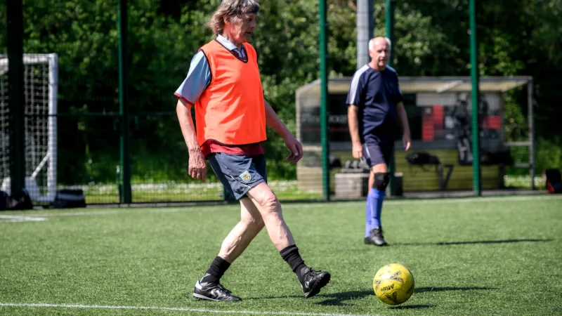 Man passing the ball in walking football