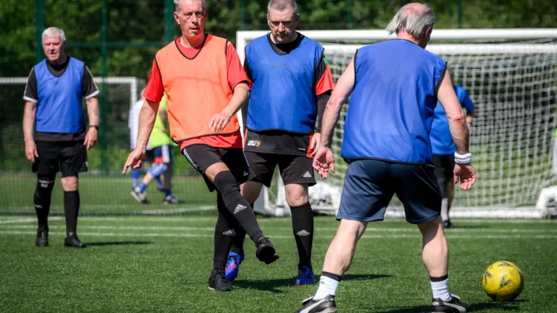 Men playing walking football at Active Bolton Arena