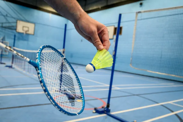 Man preparing to serve during Badminton game