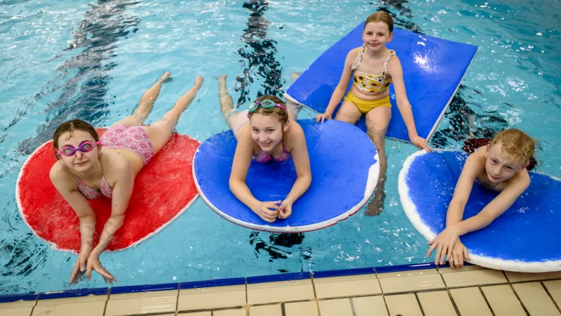 Children lied on floats at Westhoughton Leisure Centre