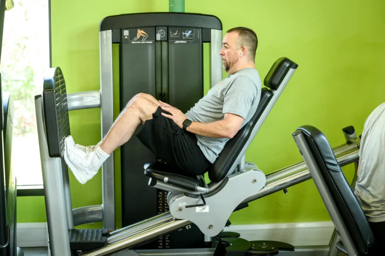 Man using leg press machine