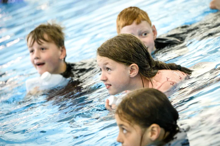 Children in the pool during swimming lessons at Horwich Leisure Centre.