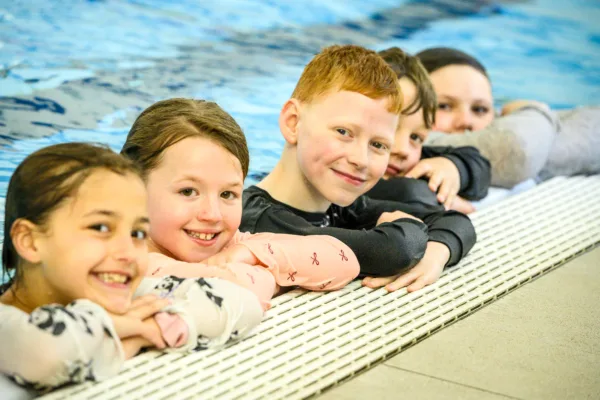 Children in the pool at Horwich Leisure Centre during children's swimming lessons.
