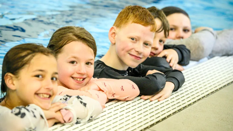 Children in the pool at Horwich Leisure Centre during children's swimming lessons.