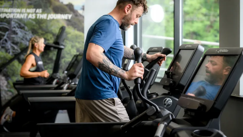 Man using cross trainer