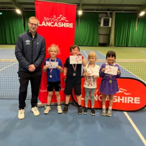 Children standing with certificates at Active Bolton Arena during Mini Tennis Lancashire