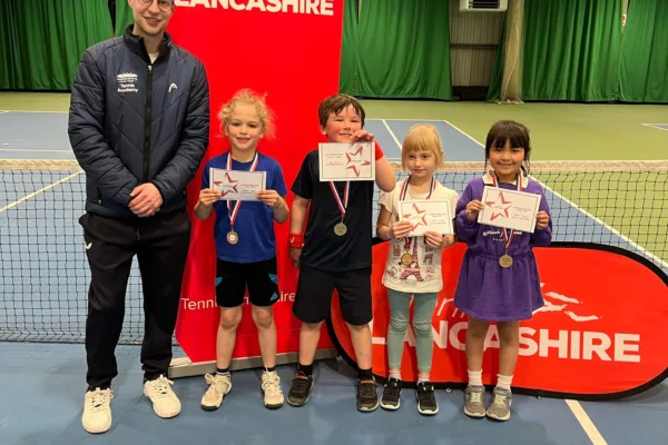 Children standing with certificates at Active Bolton Arena during Mini Tennis Lancashire